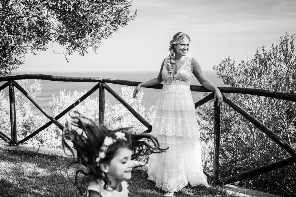 Bride dress Atelier Eme Genova Finale Liguria La Ginestra Villa Ulivi wedding photographer Italy summer reportage kid happiness Italian hair Riviera style
