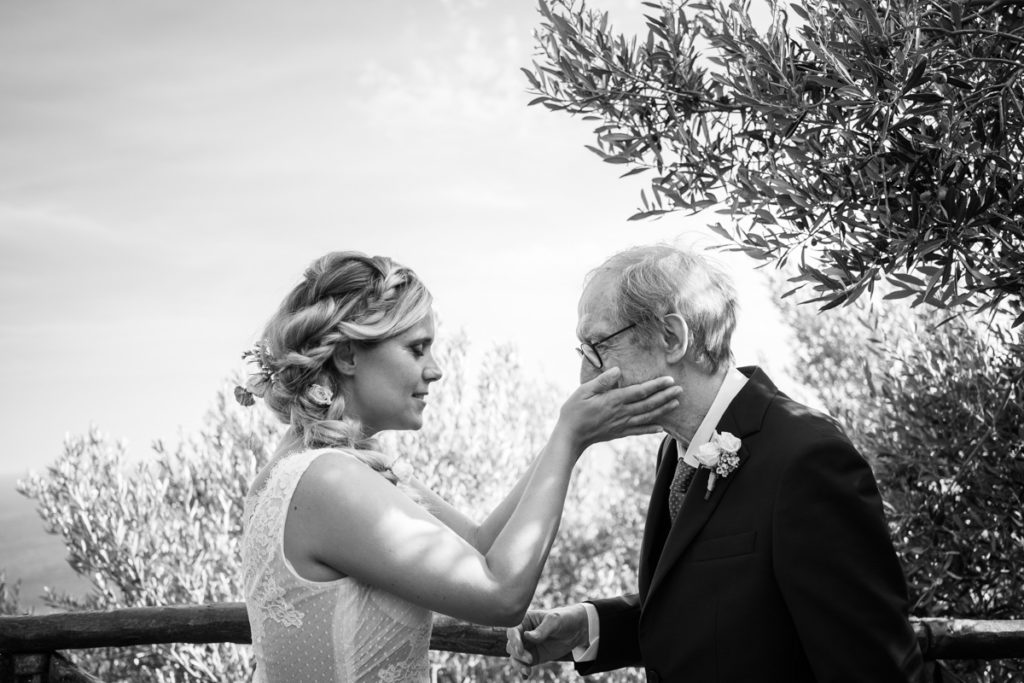 bride wedding photographer reportage emotions dad best day olives tree caress Liguria Italy events location Villa Ulivi Finale Ligure elegance records shooting emotional photos 