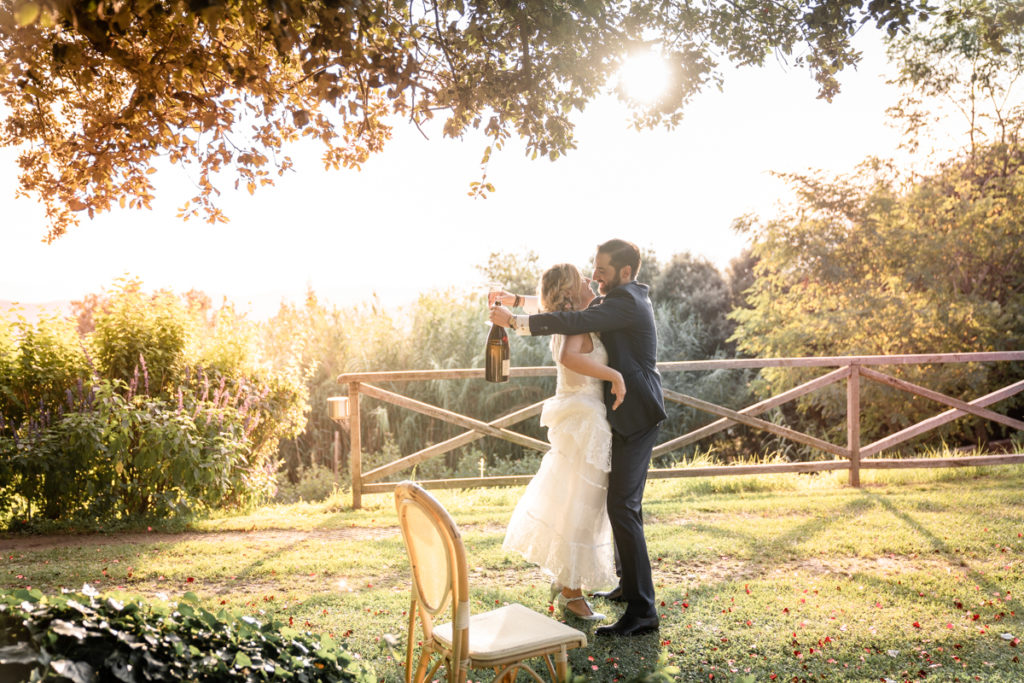 cerimony wedding photographer reportage cry bride groom La Ginestra Liguria Italy elegant summer events best location sunset  hugs prosecco cheers champagne 