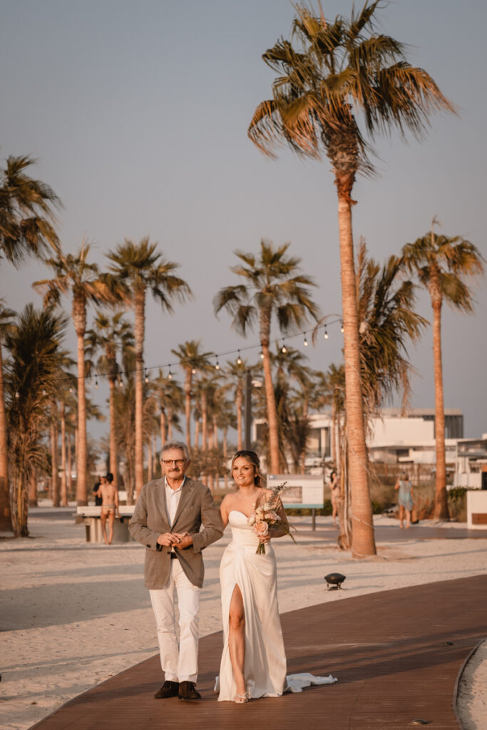 wedding, photographer, Dubai, beach, cerimony, dad, bride, dress, inspiration, palm, reportage, colors, bouquet, flowers, planner, emotions