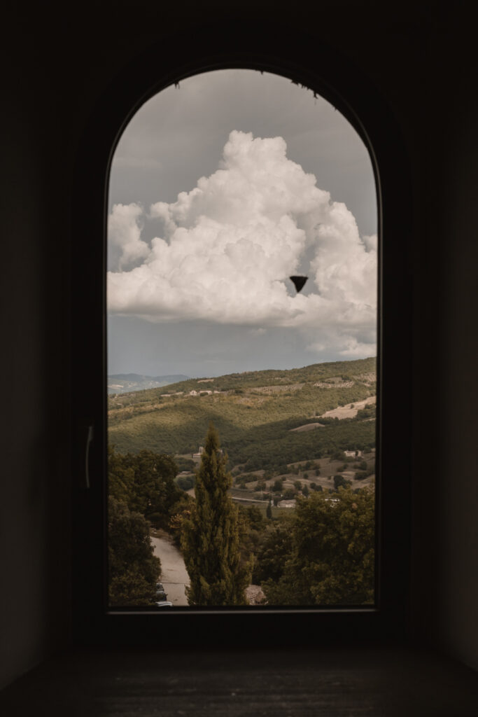 beautiful landscape in umbria from the windows with a batterfly