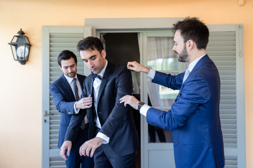 groom getting ready with friens