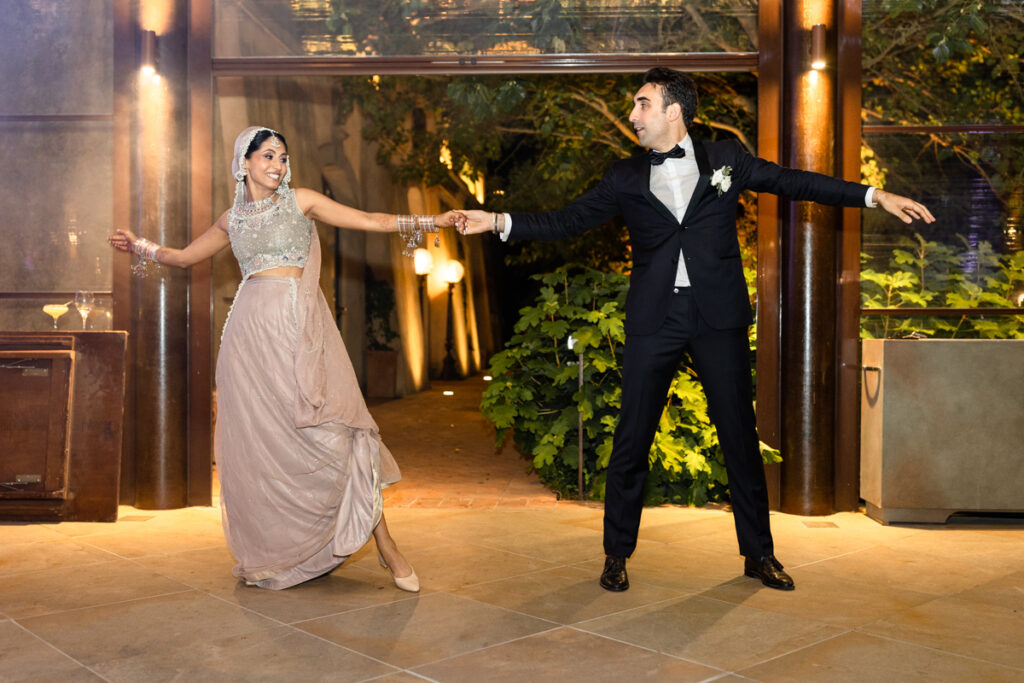 bride and groom dancing bolliwood dance together