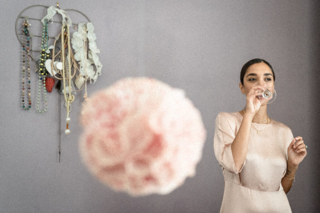 bride's friend drinking prosecco during the getting ready