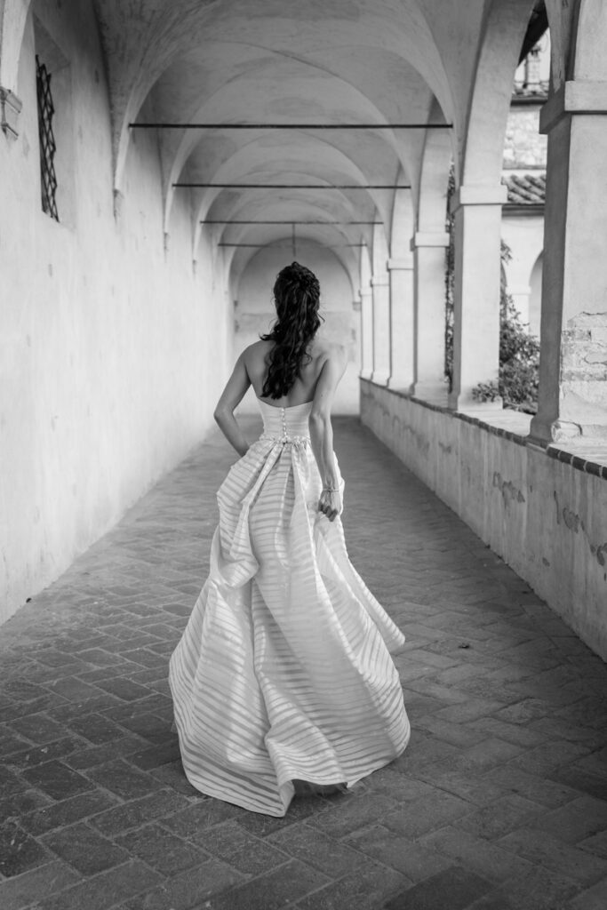 wedding photographer in Tuscany, Italy style, best wedding venue certosa di Pontignano, convento, bride dress by Peter Langner, the back