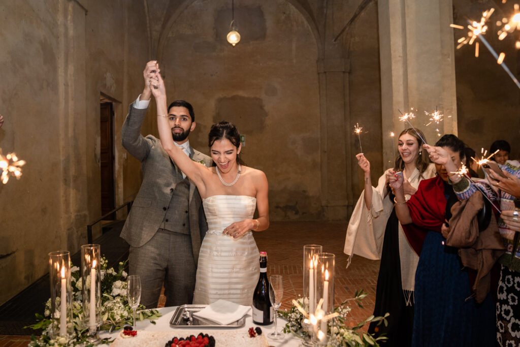 wedding photographer in Tuscany, Italy style, best wedding venue certosa di Pontignano, convento, bride dress by Peter Langner, cake moment
